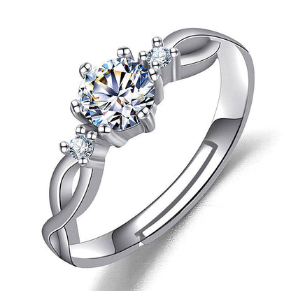 Women’s silver ring with a large imitation moissan diamond and two side stones.