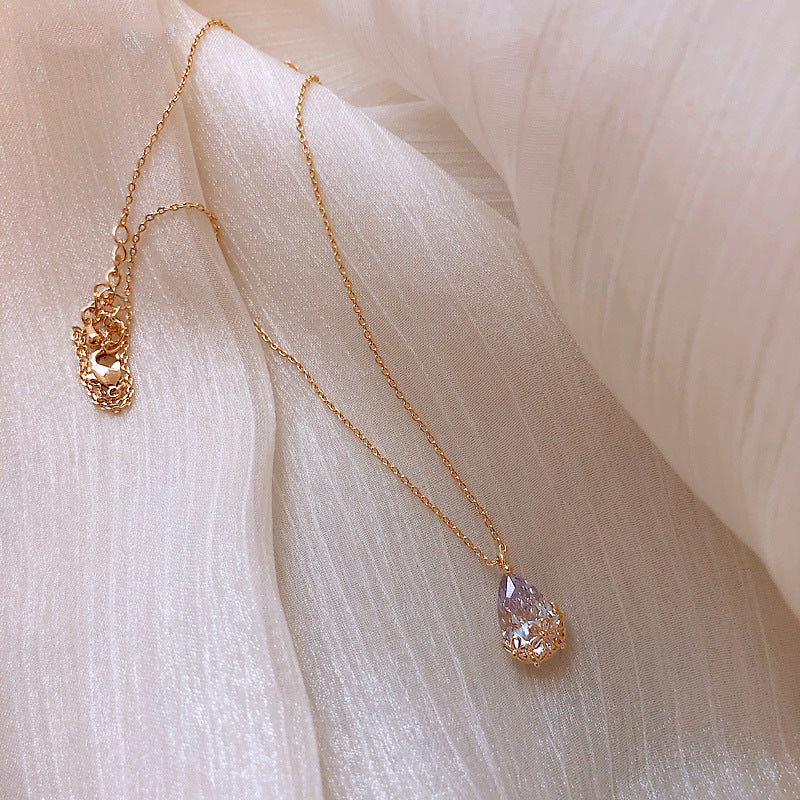 Crystal water-drop pendant necklace, gold-tone with a delicate adjustable chain