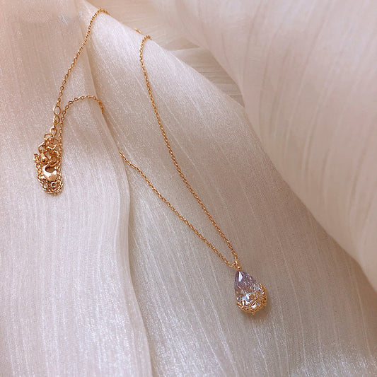 Crystal water-drop pendant necklace, gold-tone with a delicate adjustable chain