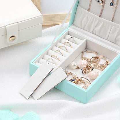 Jewelry storage box by edenista, mint PU leather, square portable case with ring slots and jewelry compartments.