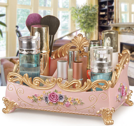 Desktop jewelry box by edenista, pink with gold ornate trim and floral detailing, holds makeup brushes and bottles