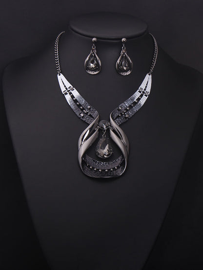 Crystal gemstone short clavicle necklace with gunmetal-tone pendant and matching teardrop earrings