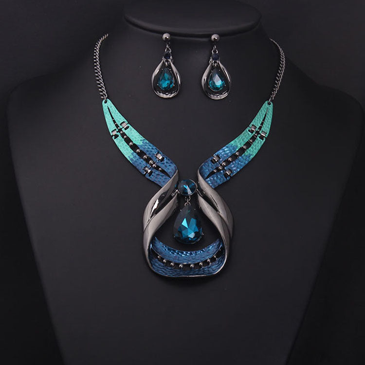 Crystal Gemstone Short Clavicle Necklace and Earrings 2-piece set with teal-blue crystals and silver-toned metal.
