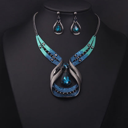 Crystal Gemstone Short Clavicle Necklace and Earrings 2-piece set with teal-blue crystals and silver-toned metal.