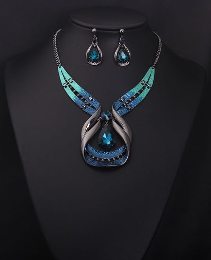Crystal Gemstone Short Clavicle Necklace with 3-piece turquoise earrings set; blue teardrop gems, silver-tone metal.