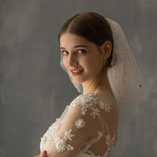 White yarn bridal multi-layer short veil by CJ with star accents.