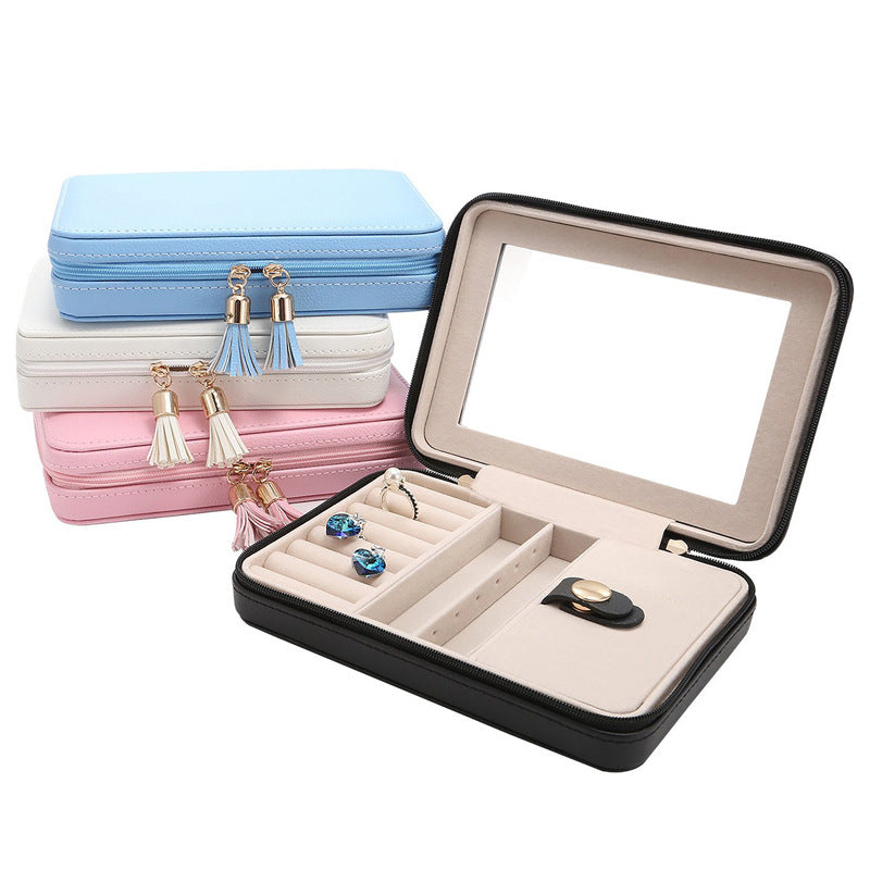edenista black portable jewelry box with beige interior and mirror; features ring slots and jewelry strap.