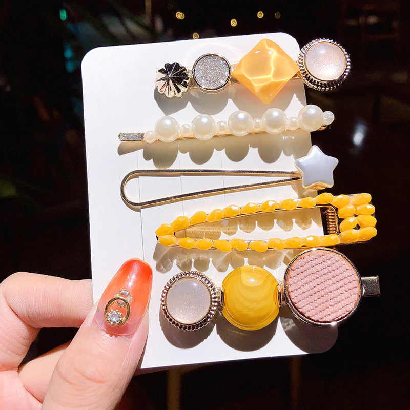 Girl's Simple Pearl Clip Set hair accessories; set of 11 clips with pearl strand and yellow bead accents