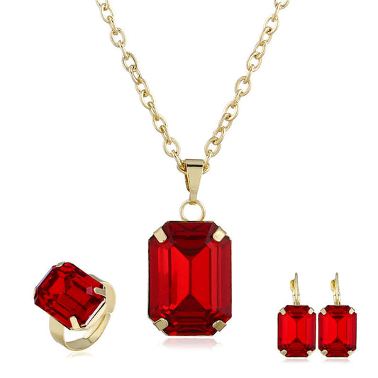 3-piece bridal jewelry set in gold-tone with emerald-cut red stones: necklace, ring, and earrings