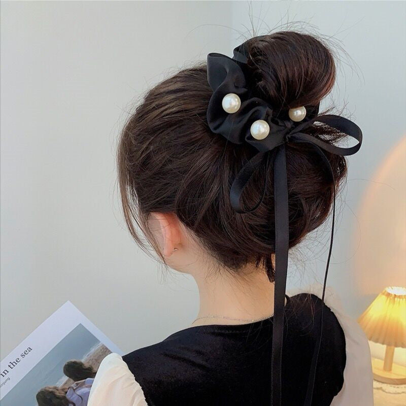 Women's black satin hairband with pearl-embellished ribbon bow knot