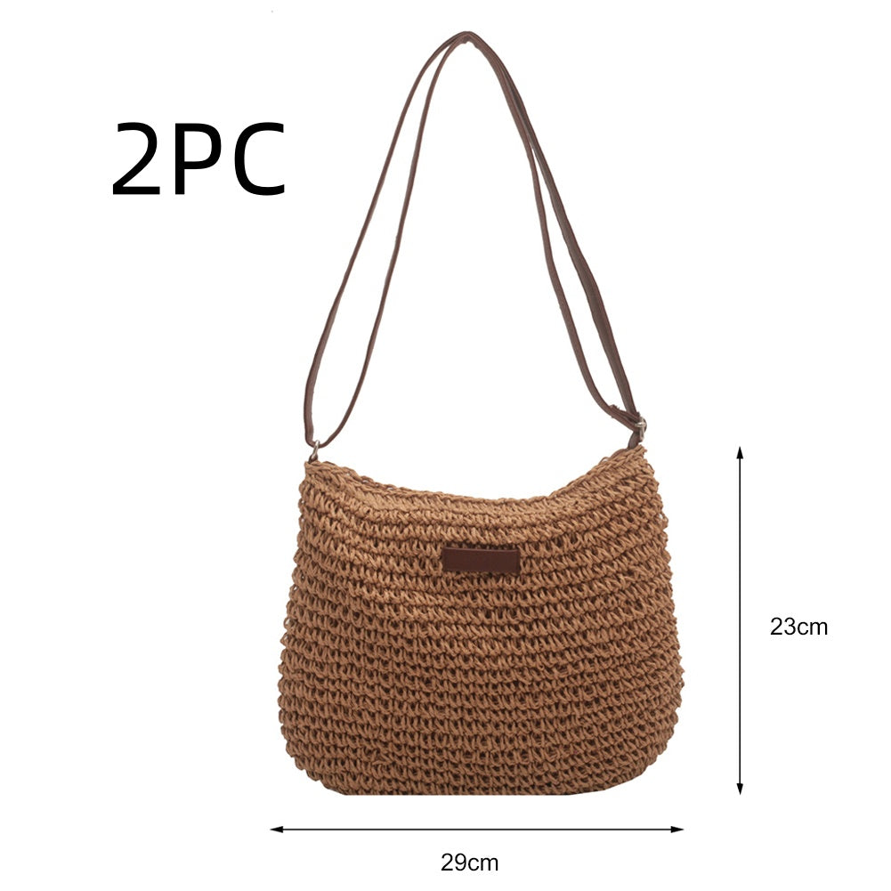 Niche Design Vacation Straw Tote Bag with natural woven straw and brown handles, 29cm wide by 23cm tall.