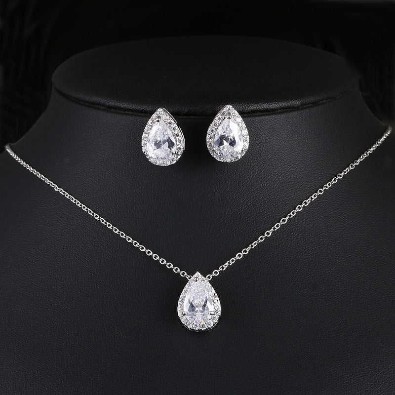 Water drop gemstone jewelry set: silver-tone necklace with teardrop pendant and pair of teardrop earrings.