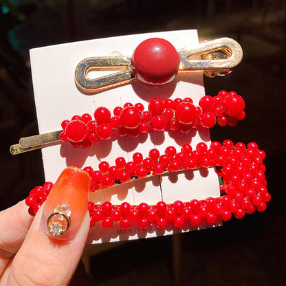 Girls' Simple Pearl Clip Set, three red beaded clips on gold-tone metal.