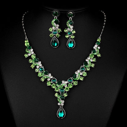 Two-piece necklace and earrings set with emerald-green and teal crystals