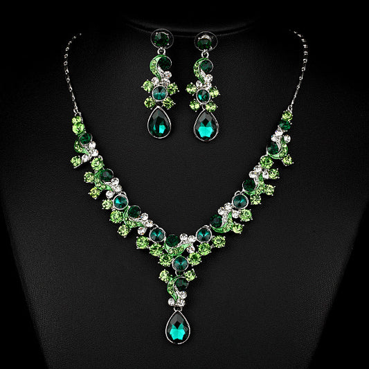 Two-piece necklace and earrings set with emerald-green and teal crystals