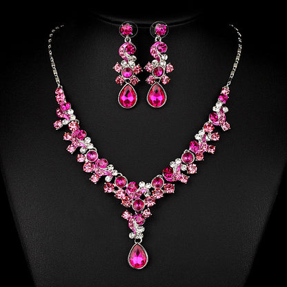 Two-piece jewelry set: pink crystal necklace with drop pendant and matching earrings, cj brand.