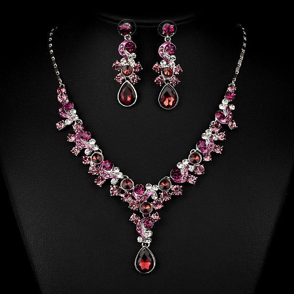 Jewelry set: pink and clear crystal necklace with matching pink earrings and red teardrop pendants