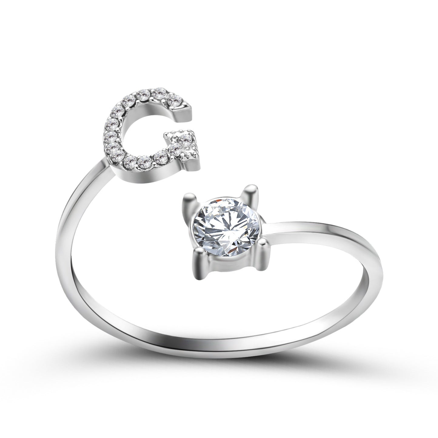 Two silver-tone rings: adjustable initial G pave ring and solitaire round-cut crystal ring