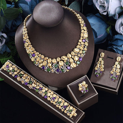 cj Exaggerated gold-tone necklace, bracelet, earrings, and ring wedding set with purple and green stones