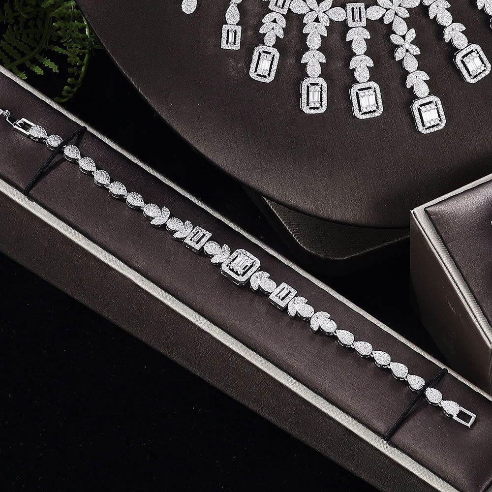 Zircon necklace, earrings, bracelet and ring set of four in silver-tone with pavé stones