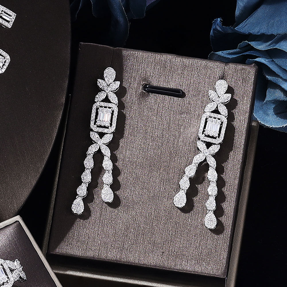 Zircon earrings by cj, silver-tone dangling drop design