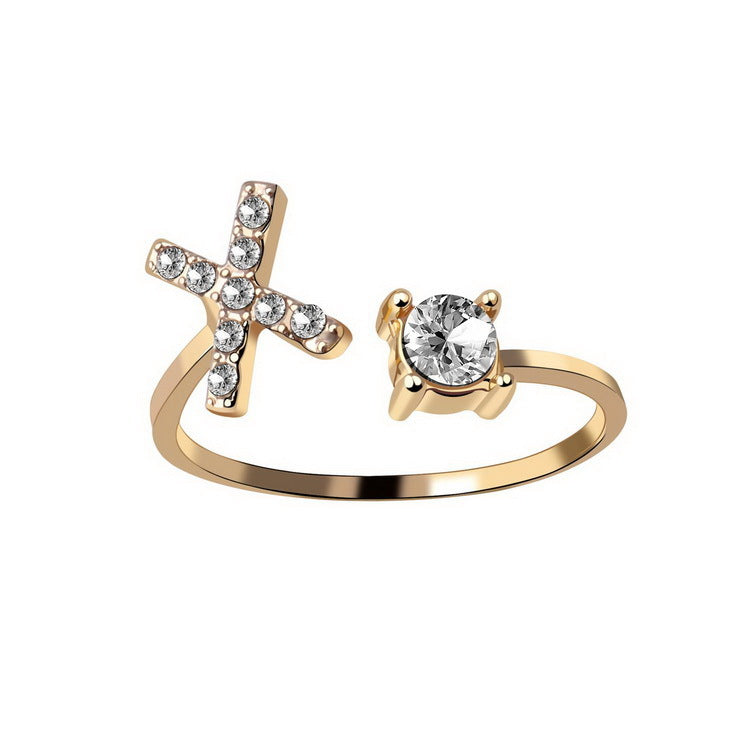 Edenista gold-tone adjustable ring with crystal-encrusted cross on one end and a solitaire gemstone on the other