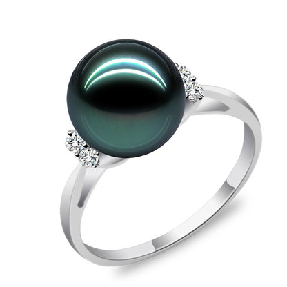 Natural Deep Sea Nanyang Pearl Ring featuring a dark pearl and side diamonds on a silver band.