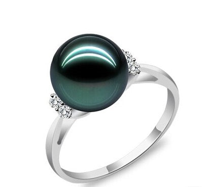 Natural Deep Sea Nanyang Pearl Ring with a dark green pearl and diamond accents on a silver band