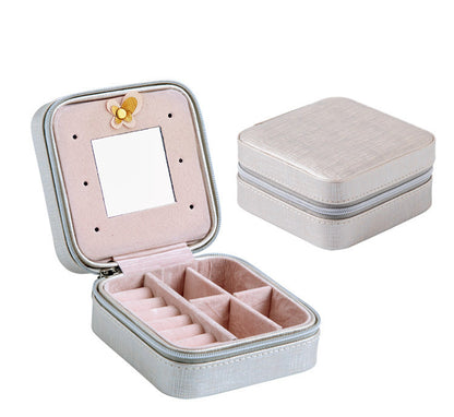 edenista portable travel jewelry box with pink interior, built-in mirror, zipper closure, and divided compartments