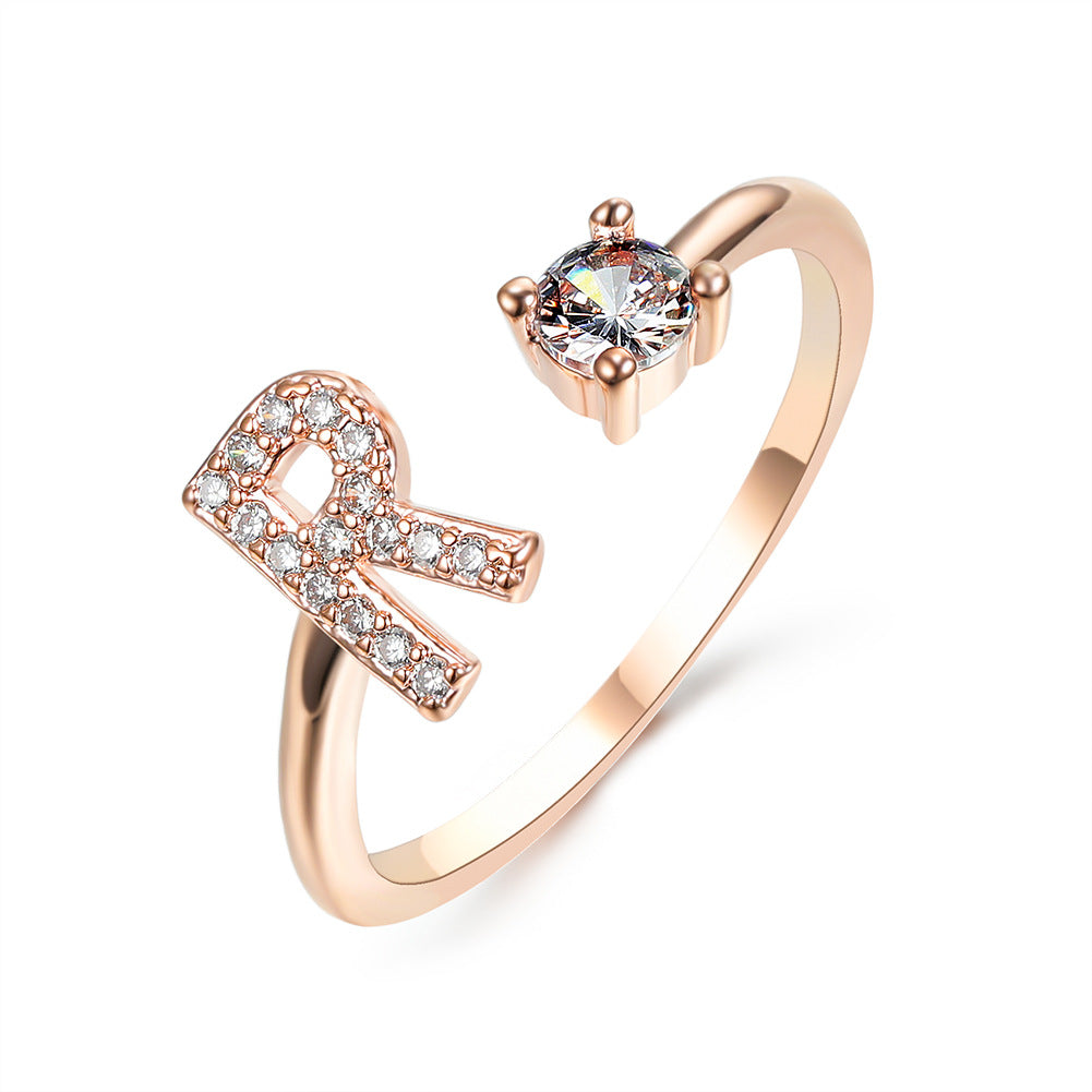 Rose gold adjustable initial letter ring with pave crystals and solitaire stone for women