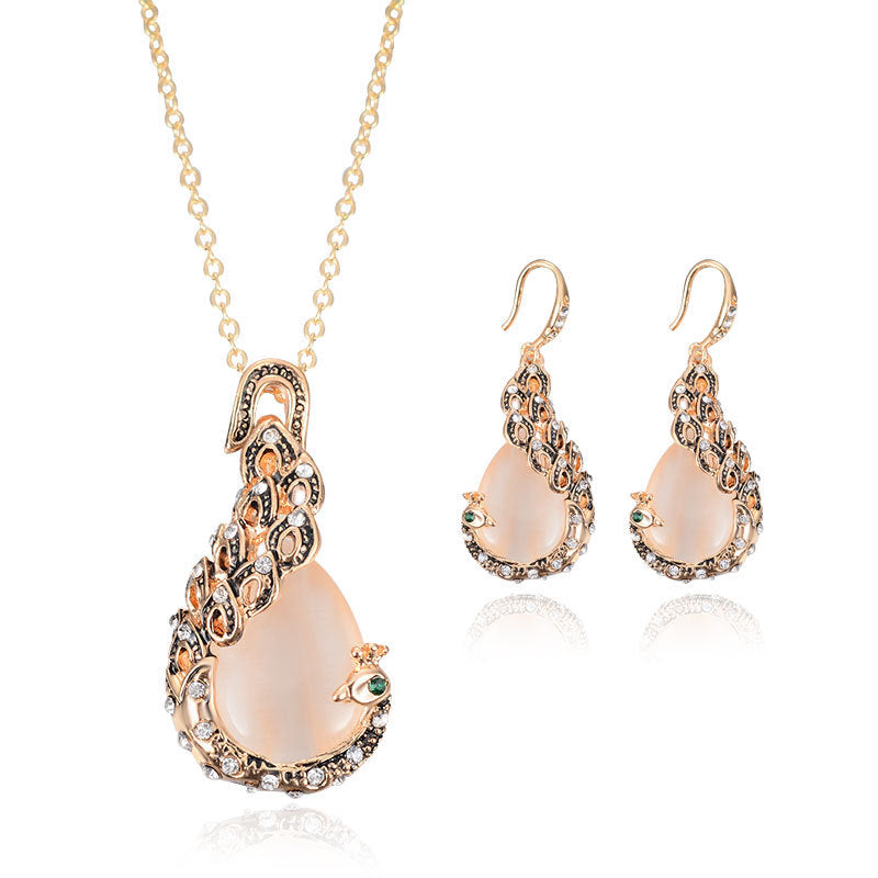 Bridal jewelry set: gold-tone peacock gem necklace and 2 matching earrings.