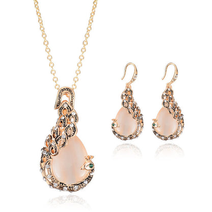 Bridal jewelry set: gold-tone peacock gem necklace and 2 matching earrings.