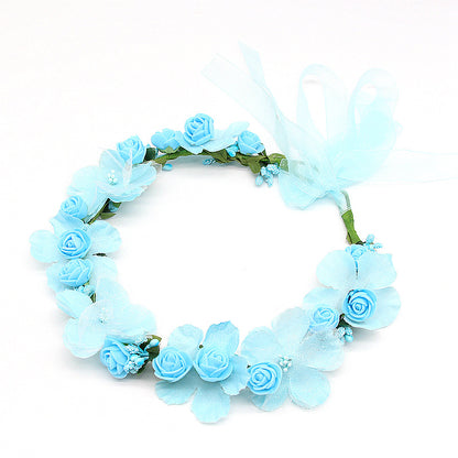 Bridal hair wreath with light blue artificial roses and petals, tied with pale blue ribbon
