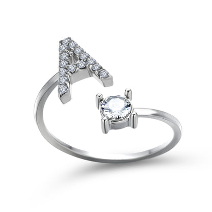 Ring adjustable silver-tone with triangular cluster of pave crystals and a prong-set solitaire stone