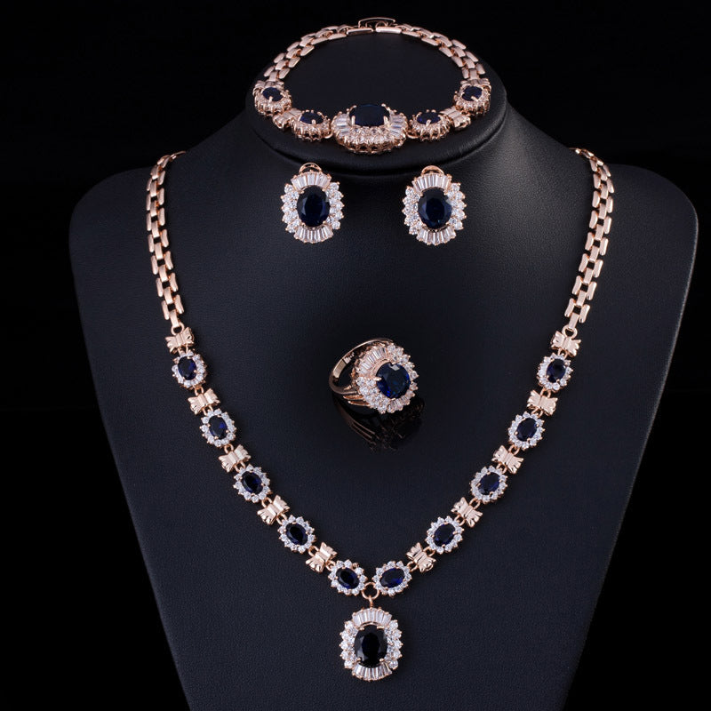 Big Brand 4-piece retro zircon jewelry set in gold tone with blue stones: necklace, bracelet, ring and earrings
