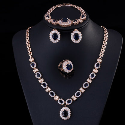 Big Brand 4-piece retro zircon jewelry set in gold tone with blue stones: necklace, bracelet, ring and earrings