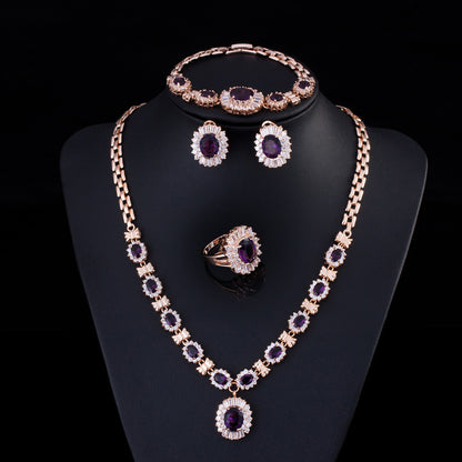 Big Brand Retro Zircon Necklace Set by CJ; gold-tone with purple stones, includes necklace, bracelet, earrings, and ring