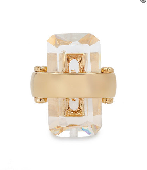 Rectangular natural stone ring with a clear rectangular-cut stone and gold-tone band