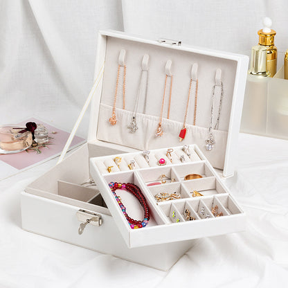 Jewelry storage box by Edenista in white with necklace bars, ring slots, and bracelet tray