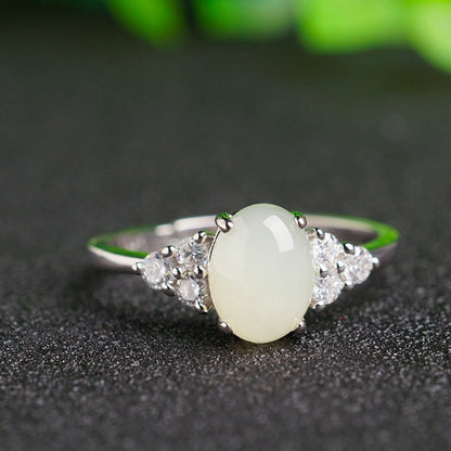 Moonstone ring, adjustable with 925 silver band and side clear stones
