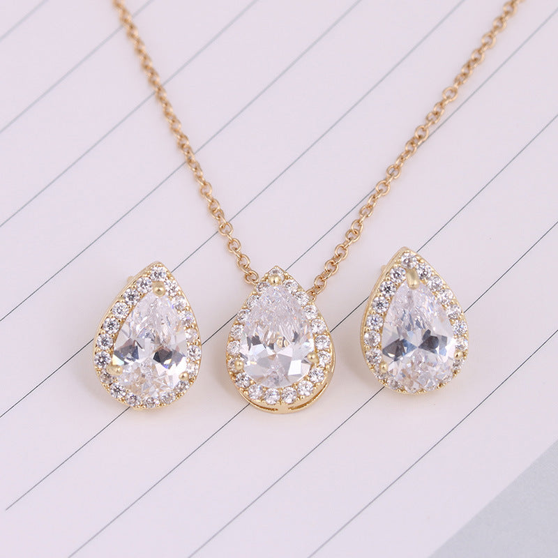 Water Drop Gemstone Necklace and Earrings set in gold-tone with clear teardrop crystals and halo pavé