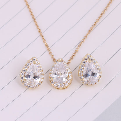 Water Drop Gemstone Necklace and Earrings set in gold-tone with clear teardrop crystals and halo pavé
