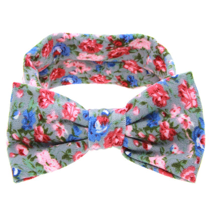Floral children's hairband with bow on blue-gray fabric featuring pink and red flowers by CJ