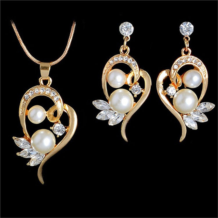 Gold-tone bridal necklace set with pearl drops and crystal accents; includes 1 necklace and 2 matching earrings