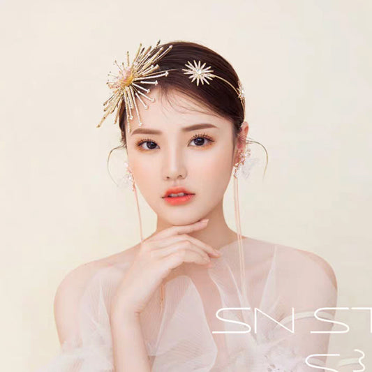 Bridal rhinestone headband with two gold-tone starburst accents, wedding hair accessory