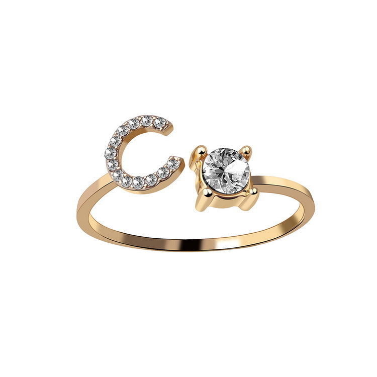 Ring edenista: adjustable gold-tone initial C with a crystal-studded crescent and a solitaire crystal setting