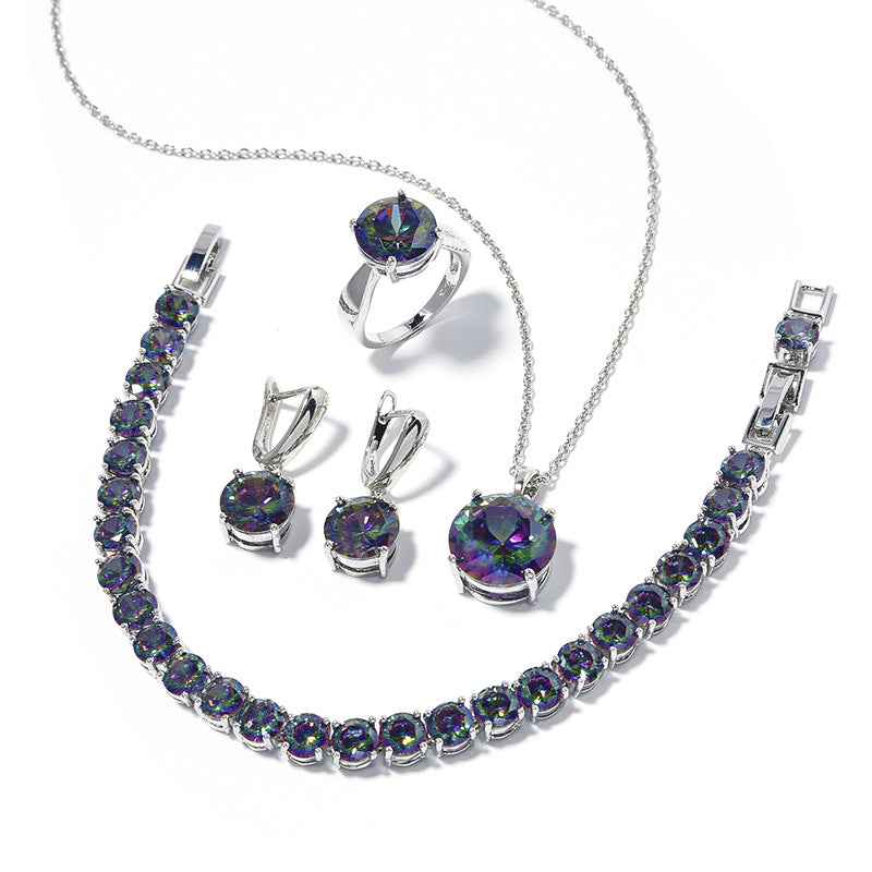 Geometric round silver jewelry set with purple-green iridescent stones; includes necklace, bracelet, ring and earrings (cj)