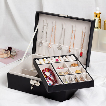 edenista jewelry storage box; black exterior, beige interior, multi-compartment organizer with hanging necklaces.