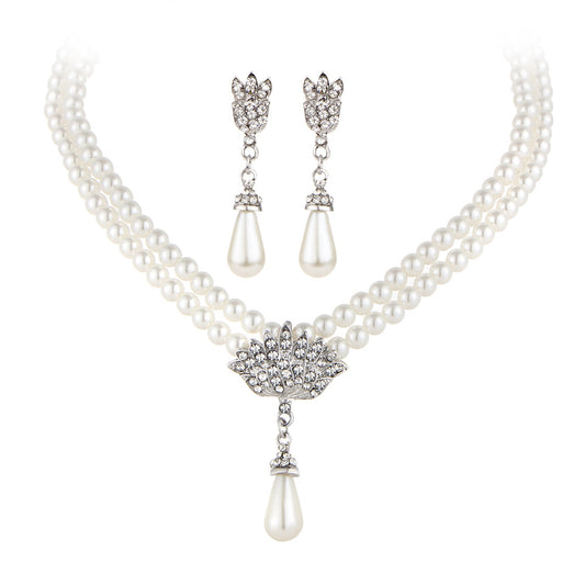 Bridal pearl crystal necklace set with double-strand pearls, pearl drop pendant, and matching earrings