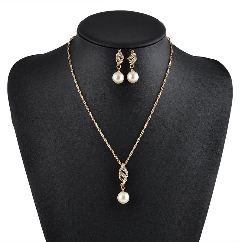 Pearl necklace and matching pearl drop earrings set with gold-tone chain and crystal-accent pendant